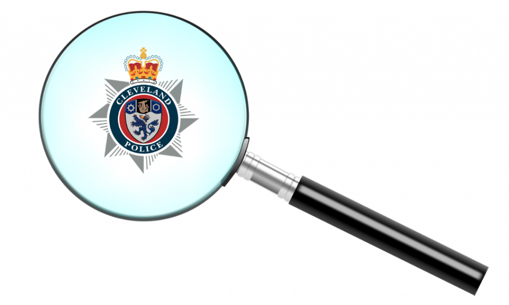 Magnifying glass with Cleveland Police logo in the centre